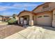 Charming single-story home with a well-maintained lawn and a spacious two car driveway at 4723 W Samantha Way, Laveen, AZ 85339