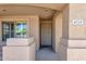 Inviting front porch featuring decorative pillars and a security screen door at 4723 W Samantha Way, Laveen, AZ 85339