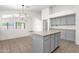 Kitchen with gray cabinets and island, offering ample counter space and an open layout at 4723 W Samantha Way, Laveen, AZ 85339