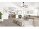 Open-concept living room flows seamlessly into a modern kitchen and cozy dining area at 4723 W Samantha Way, Laveen, AZ 85339