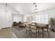 Bright living room features lots of natural light, neutral tones, and an adjacent dining area at 4723 W Samantha Way, Laveen, AZ 85339