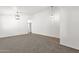 Expansive living room with tile accents and decorative pendant lighting fixtures at 4723 W Samantha Way, Laveen, AZ 85339