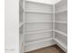 White pantry with shelving and tile floor at 4723 W Samantha Way, Laveen, AZ 85339