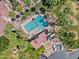 Aerial view of a community pool surrounded by palm trees and manicured lawns at 4901 S Calle Los Cerros Dr # 119, Tempe, AZ 85282