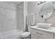 Modern bathroom with white marble tile, vanity, and a bathtub with shower at 4901 S Calle Los Cerros Dr # 119, Tempe, AZ 85282