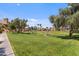 Lush community grounds feature green grass, picnic tables, and mature trees at 4901 S Calle Los Cerros Dr # 119, Tempe, AZ 85282