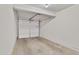 Clean garage with an open door and smooth concrete flooring at 4901 S Calle Los Cerros Dr # 119, Tempe, AZ 85282