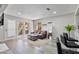 Inviting living room filled with light with modern flooring, a comfortable sofa, stylish coffee table, and modern details at 4901 S Calle Los Cerros Dr # 119, Tempe, AZ 85282
