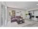 Cozy living room featuring a comfortable leather sofa, stylish coffee table, and a light-filled window at 4901 S Calle Los Cerros Dr # 119, Tempe, AZ 85282