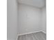 Small empty room features neutral walls, baseboards, and light wood laminate flooring at 4901 S Calle Los Cerros Dr # 119, Tempe, AZ 85282