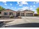 Charming single-story home with a three-car garage and well-maintained landscaping at 5543 W Kowalsky Ln, Laveen, AZ 85339