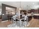 Open-concept kitchen with a spacious island and adjacent dining area at 5543 W Kowalsky Ln, Laveen, AZ 85339