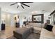 Comfortable living room area showcasing neutral tones and seamless flow to kitchen at 5543 W Kowalsky Ln, Laveen, AZ 85339
