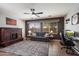 Stylish living room featuring a rustic fireplace, comfortable seating, and neutral decor at 5543 W Kowalsky Ln, Laveen, AZ 85339