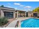 Relaxing backyard features a sparkling pool, pool house, shed, and outdoor seating at 5543 W Kowalsky Ln, Laveen, AZ 85339