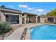 Backyard features a sparkling pool, pool house with bar, outdoor seating and shed at 5543 W Kowalsky Ln, Laveen, AZ 85339
