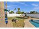 Outdoor living space with manicured lawn, a BBQ, seating, and a pool, perfect for gatherings and relaxation at 6401 E Voltaire Ave, Scottsdale, AZ 85254
