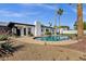 Backyard featuring a pool, mature trees, and an inviting patio area, blending relaxation with natural beauty at 6401 E Voltaire Ave, Scottsdale, AZ 85254