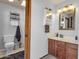 Bathroom featuring a vanity with storage, a toilet, and a skylight at 6401 E Voltaire Ave, Scottsdale, AZ 85254