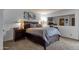 Bedroom showcasing dark wood furniture and a large mirror accenting the space at 6401 E Voltaire Ave, Scottsdale, AZ 85254