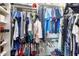 Walk-in closet with neatly organized clothing racks and ample storage space at 6401 E Voltaire Ave, Scottsdale, AZ 85254