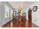 Dining room with wood floors and a table with seating for four at 6401 E Voltaire Ave, Scottsdale, AZ 85254