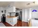 Well-appointed kitchen features stainless steel appliances, hardwood floors, and ample counter space at 6401 E Voltaire Ave, Scottsdale, AZ 85254