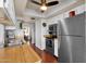 Functional kitchen with hardwood countertops, updated appliances, and access to the dining area at 6401 E Voltaire Ave, Scottsdale, AZ 85254