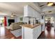 Open-concept kitchen flows into the living room, hardwood floors, offering a welcoming space for Gathering gatherings at 6401 E Voltaire Ave, Scottsdale, AZ 85254