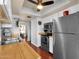 Functional kitchen with hardwood countertops, updated appliances, and access to the dining area at 6401 E Voltaire Ave, Scottsdale, AZ 85254