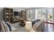 Inviting living room with a large TV, stylish furniture, and ample natural light creating a cozy atmosphere at 6401 E Voltaire Ave, Scottsdale, AZ 85254