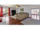 Spacious living room offering hardwood floors and natural light and seamless flow into dining at 6401 E Voltaire Ave, Scottsdale, AZ 85254