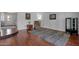 Living room with wood floors and neutral walls adjacent to the dining room at 6401 E Voltaire Ave, Scottsdale, AZ 85254