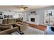 Open concept living room flows into kitchen with hardwood floors and a fireplace, ideal for entertaining at 6401 E Voltaire Ave, Scottsdale, AZ 85254