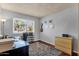 Home office featuring a desk, a view to the street, and built in shelving for storage at 6401 E Voltaire Ave, Scottsdale, AZ 85254