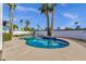 Lush backyard showcasing a sparkling pool, mature palm trees, and green lawn, perfect for enjoying the outdoors at 6401 E Voltaire Ave, Scottsdale, AZ 85254