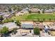 Aerial view of a home located nearby a school and community park at 6501 W Columbus Ave, Phoenix, AZ 85033