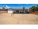 The spacious backyard features a gravel ground cover, a privacy fence, and a covered patio at 6501 W Columbus Ave, Phoenix, AZ 85033