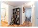 Hallway with tile floor, neutral walls, and a view to the bathroom and other rooms at 6501 W Columbus Ave, Phoenix, AZ 85033