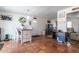 Open-concept living space with tile flooring, dining area, and comfortable seating, creating a welcoming atmosphere at 6501 W Columbus Ave, Phoenix, AZ 85033