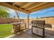 Backyard featuring a covered patio with outdoor grill area at 6701 W Catalina Dr, Phoenix, AZ 85033