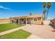 Backyard view with artifical turf, patio, BBQ, and fence at 6701 W Catalina Dr, Phoenix, AZ 85033
