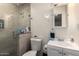 Bathroom featuring a tile shower, vanity and commode at 6701 W Catalina Dr, Phoenix, AZ 85033