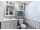 Neutral bathroom with vanity sink, framed mirror, and combination shower and tub at 6701 W Catalina Dr, Phoenix, AZ 85033