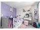 Charming bedroom with white furniture, pretty decor, and comfortable furnishings at 6701 W Catalina Dr, Phoenix, AZ 85033