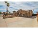 Spacious property with a long driveway and manicured landscaping, offering curb appeal at 6701 W Catalina Dr, Phoenix, AZ 85033