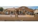 Charming single-story home with a well-maintained front yard and decorative fence at 6701 W Catalina Dr, Phoenix, AZ 85033