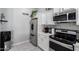 Close-up of the kitchen appliances and white cabinetry, adding a stylish touch at 6701 W Catalina Dr, Phoenix, AZ 85033