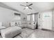 Cozy living room featuring a sectional sofa, ceiling fan, and neutral color palette at 6701 W Catalina Dr, Phoenix, AZ 85033