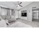 Comfortable living room with a plush sofa, modern fixtures, and built-in shelving at 6701 W Catalina Dr, Phoenix, AZ 85033